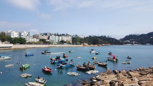 High angle view of boats in sea against sky