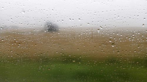 Full frame shot of wet glass window