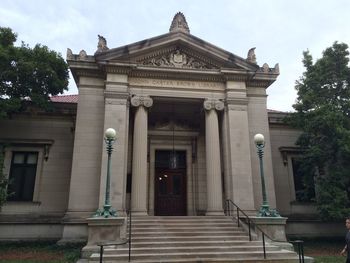 Facade of historic building against sky