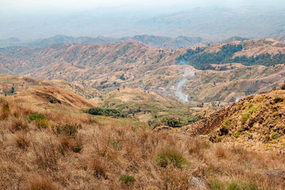 High angle view of volcanic valley against mountains at mbeya peak in mbeya region,tanzania