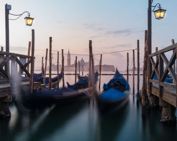 Boats moored in canal