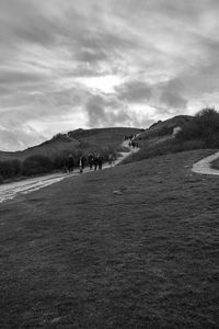 Scenic view of landscape against cloudy sky