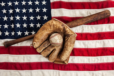 Directly above shot of flag against colored background