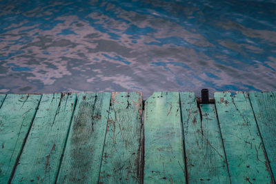 Close-up of wooden fence on pier