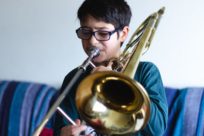 Portrait of boy playing with eyeglasses