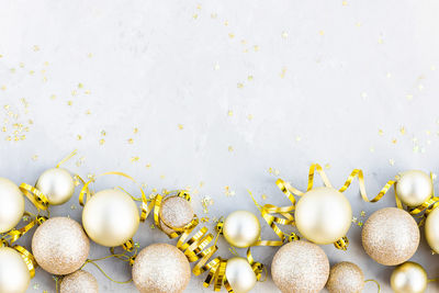 Close-up of christmas decorations on white background