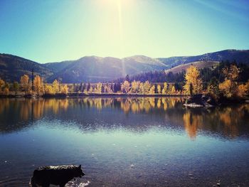 Scenic view of lake with mountains in background