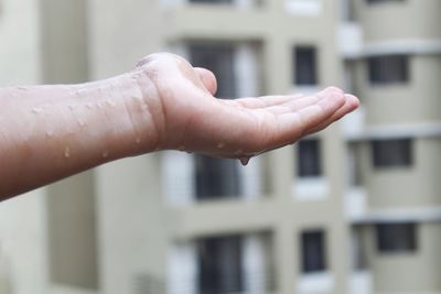 Close-up of hand against blurred background