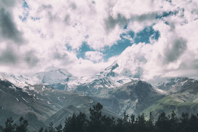 Scenic view of snowcapped mountains against sky