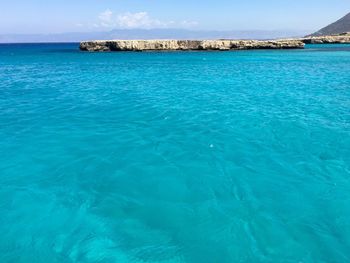 Scenic view of sea against blue sky