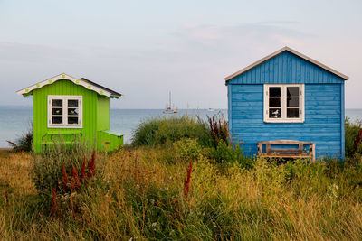 House on beach against sky