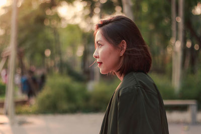 Portrait of a young woman looking away