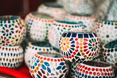 Close-up of multi colored ceramics for sale at market