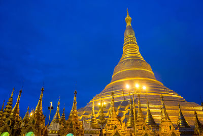 Low angle view of pagoda against blue sky