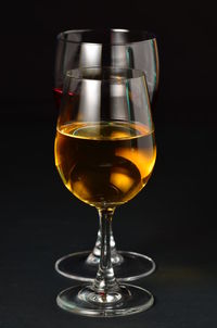 Close-up of beer glass on white background