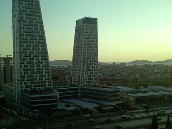 Modern buildings in city against clear sky