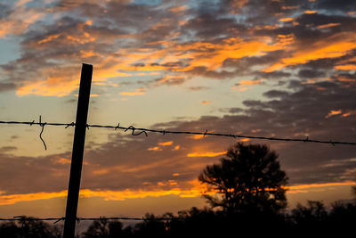 Low angle view of cloudy sky at sunset