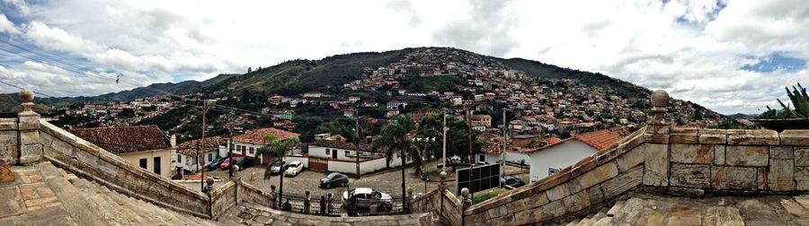 High angle shot of townscape against cloudy sky