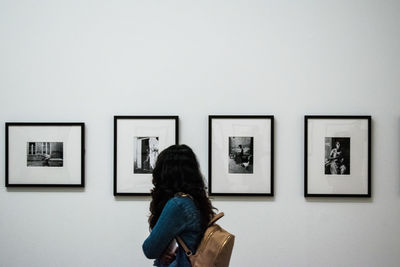 Rear view of woman in museum