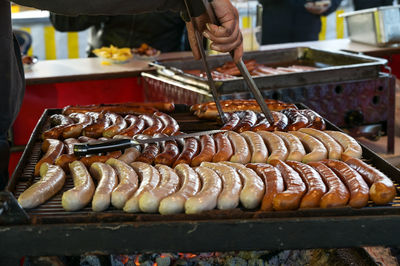 Close-up of preparing food on barbecue grill