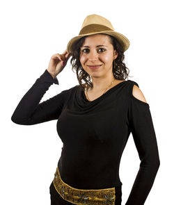 Portrait of smiling young woman against white background