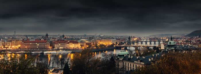 View of cityscape against cloudy sky