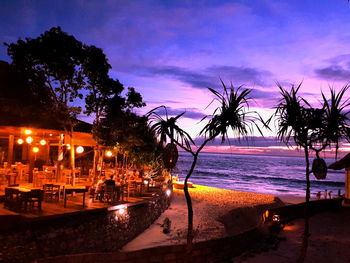 View of swimming pool at beach during sunset