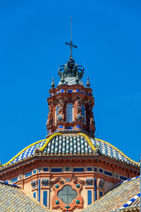 Low angle view of building against blue sky