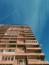 Low angle view of building against blue sky