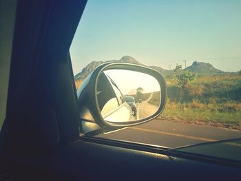 Reflection of car on side-view mirror