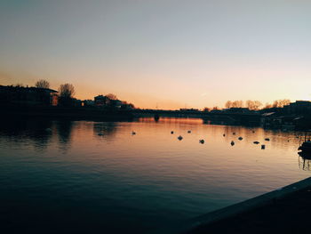 Scenic view of lake against sky during sunset