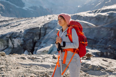 Rear view of woman standing on mountain