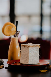 Close-up of juice and pastry on table