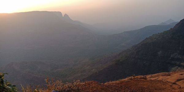Scenic view of mountains against sky during sunset