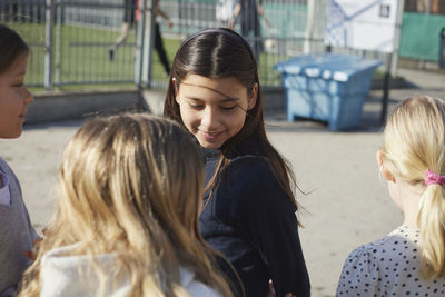 Smiling girl friends spending time outdoors