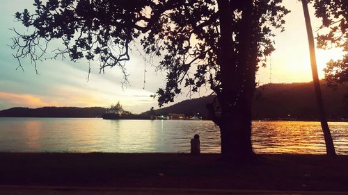 Scenic view of lake at sunset