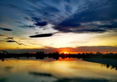 Scenic view of lake against sky during sunset