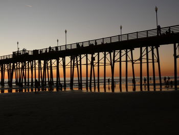 Pier over sea against sky