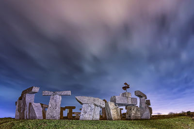 Old ruin building on field against sky