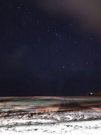 Scenic view of sea against sky at night