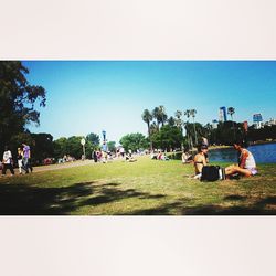 People relaxing in park