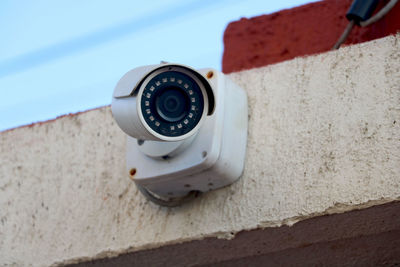 Close-up of camera on wall