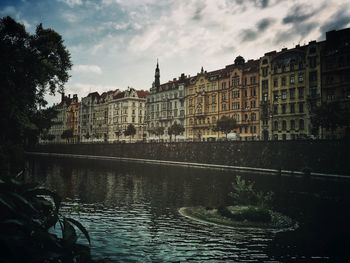 View of buildings against cloudy sky