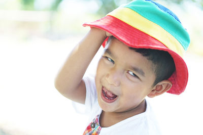 Close-up portrait of cute boy wearing hat