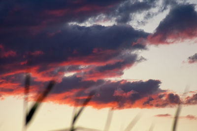 Low angle view of dramatic sky during sunset