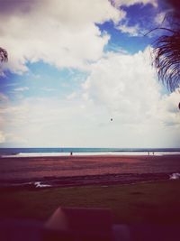 Scenic view of sea against cloudy sky