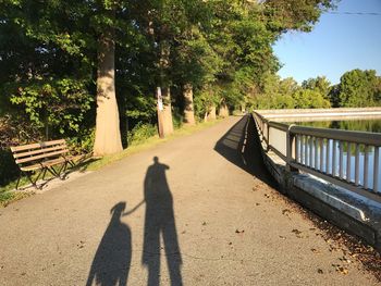 Shadow of people on footpath