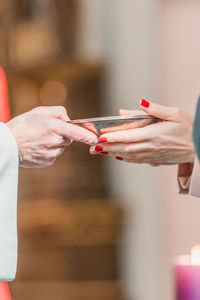 Midsection of woman using mobile phone