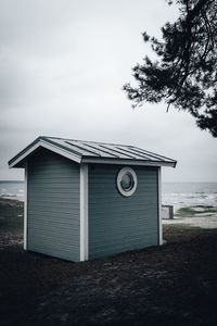 Scenic view of sea against sky. fishing hut in the foreground. 