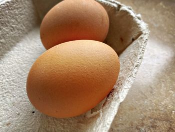High angle view of eggs in container on table